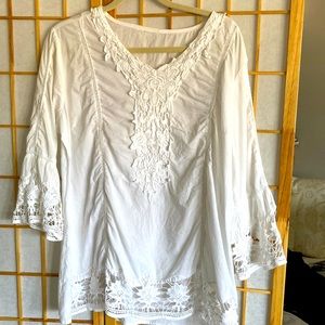 White cotton top with beautiful crochet bottom and sleeves. Purchased in Mexico.